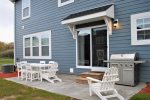 The Beachcomber Cottage`s dining room patio doors connect the main living space with the outdoor living space, making the BBQ grill convenient and accessible.